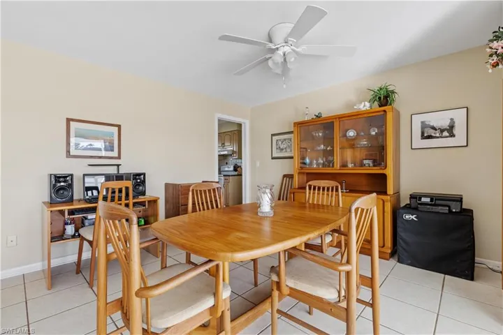 Dining Area with entry to Kitchen in center background.