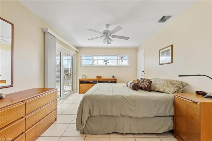 Bright Master Bedroom with Impact Sliding Doors to the Lanai.