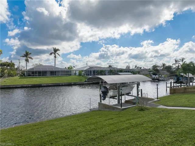 View of canal and 7,000 lb. boat lift with canopy looking to the southeast.