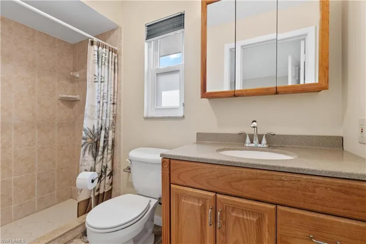 Master Bathroom with Shower and Impact Window.