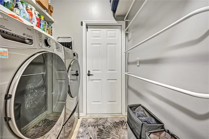 Laundry area featuring independent washer and dryer