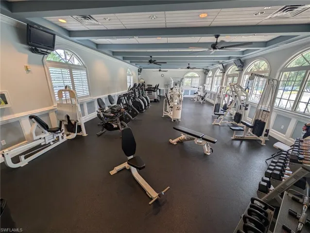 Exercise room featuring a ceiling fan and recessed lighting