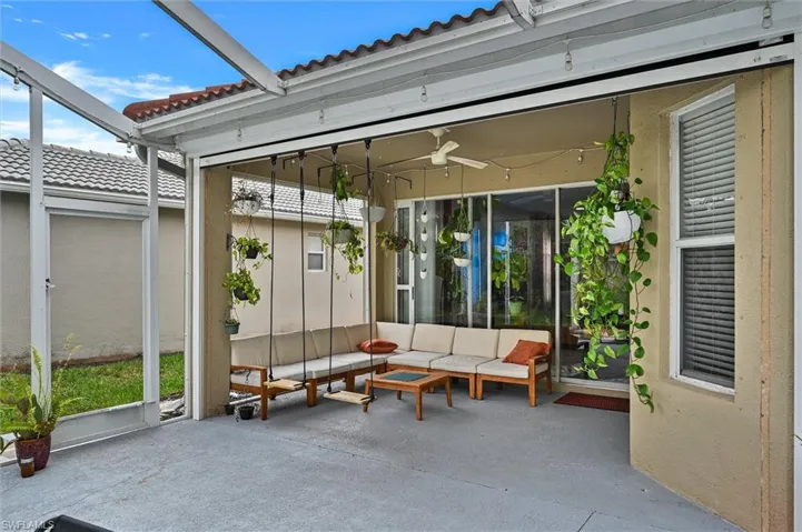 View of patio featuring a ceiling fan and outdoor seating