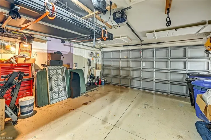 Garage featuring a garage door opener