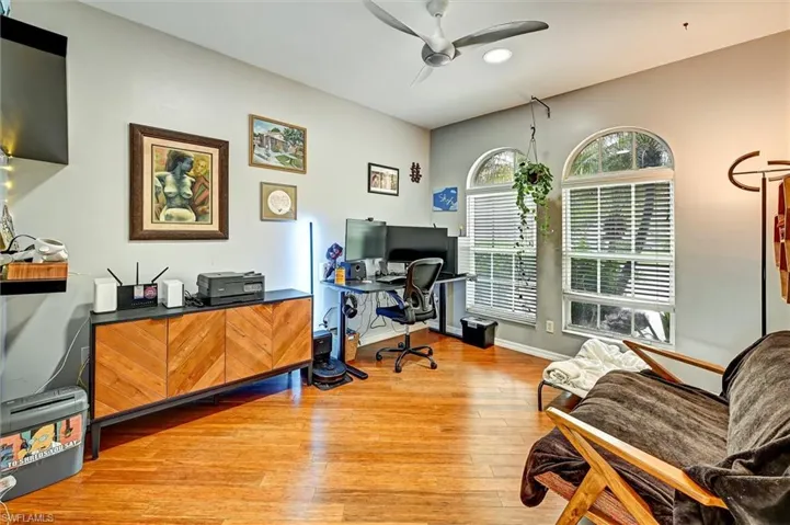 Office space featuring a ceiling fan and light wood finished floors
