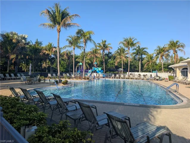 Community pool with a patio area