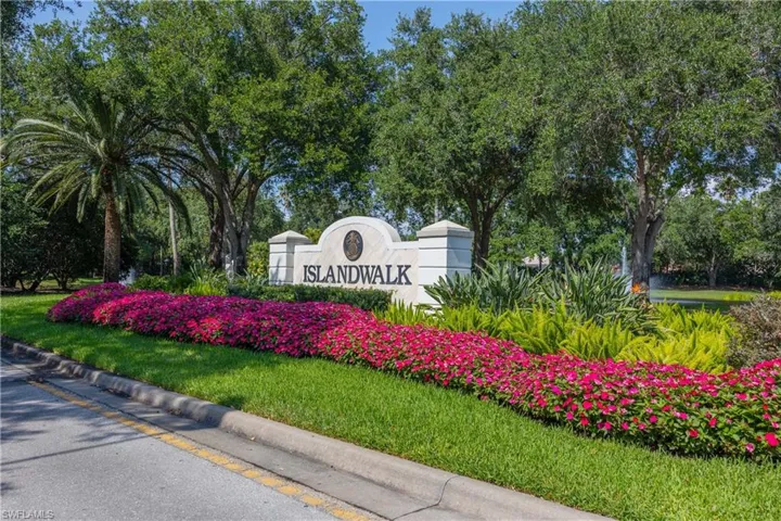 Community / neighborhood sign with a yard