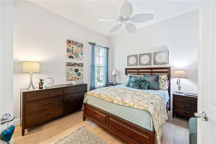 Bedroom with light wood-type flooring and ceiling fan