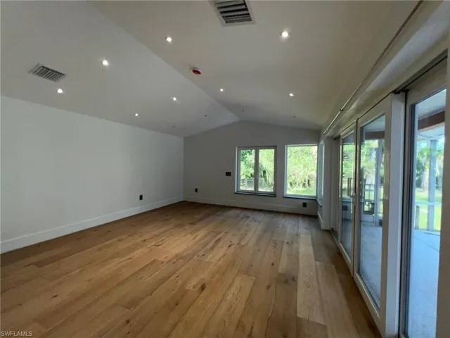 Bonus room featuring vaulted ceiling, light wood-type flooring, and recessed lighting