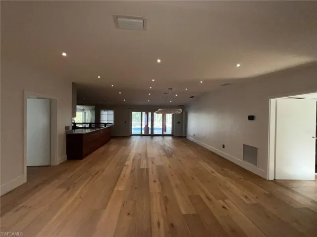 Unfurnished living room with light wood-style flooring and recessed lighting