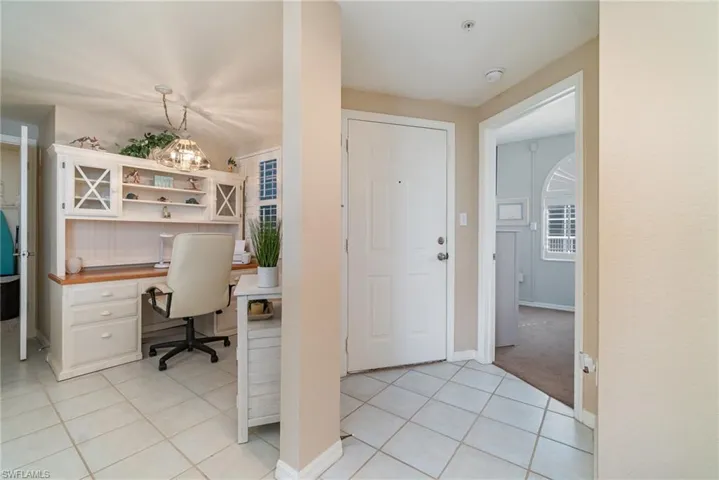Office area with light tile patterned floors