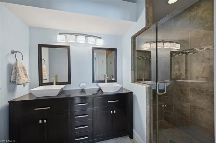 Bathroom featuring vanity and walk in shower