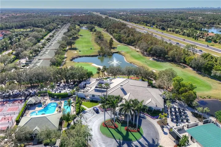 Aerial view of Cypress Woods clubhouse with a water view
