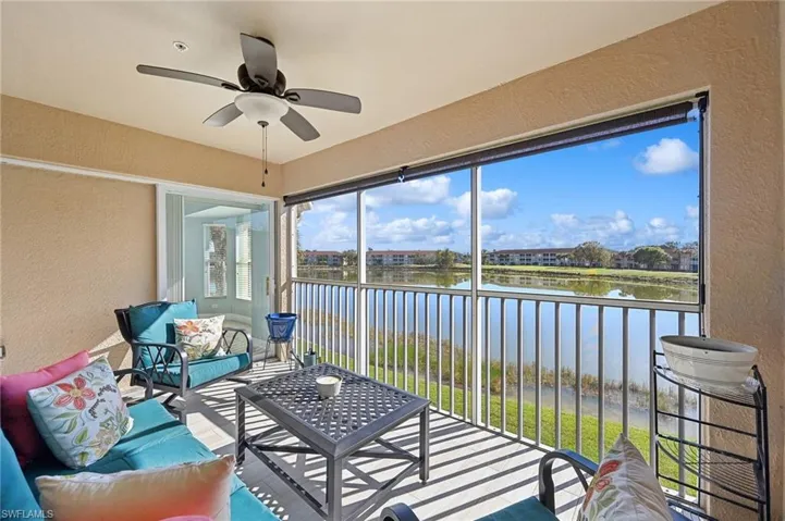 SE facing Lanai featuring ceiling fan and a water view