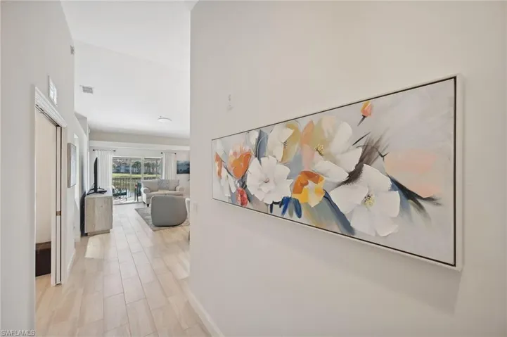 Foyer with light hardwood / wood-style flooring
