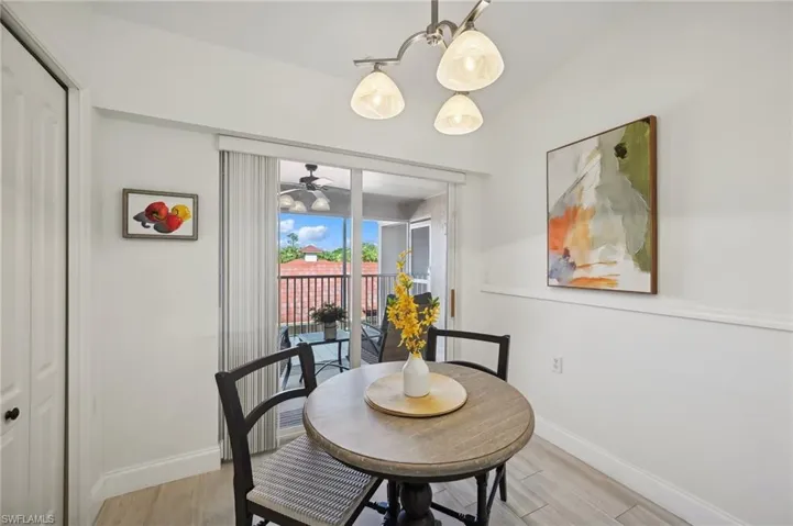 Kitchen Dining with light hardwood / wood-style flooring and ceiling fan
