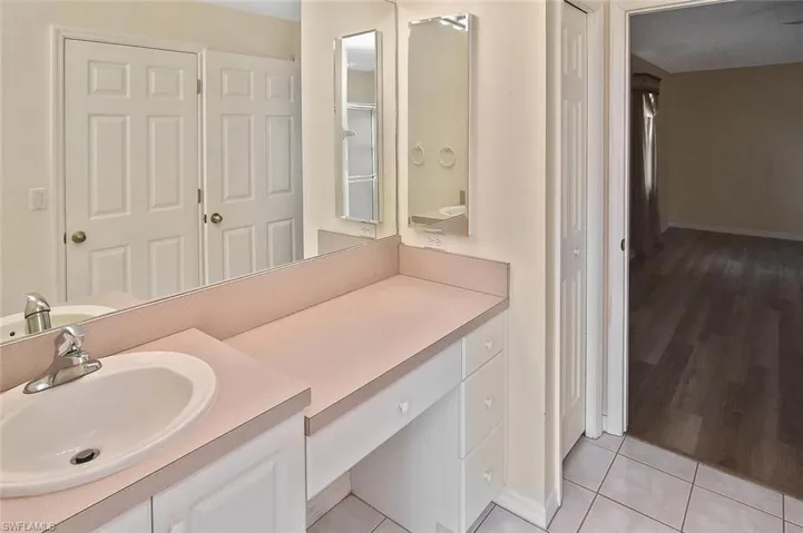 Bathroom featuring vanity and light tile patterned floors