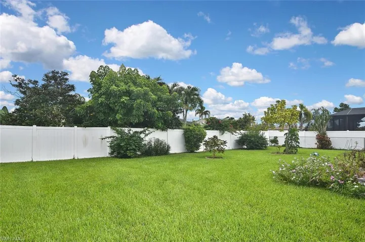 View of fenced backyard