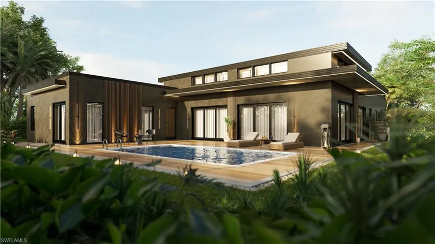 Back of property with a patio area and an outdoor pool