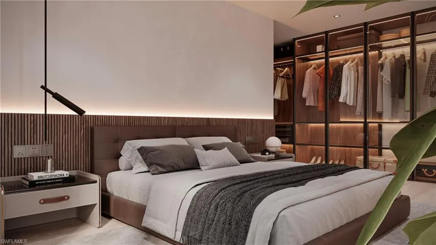 Bedroom with wooden walls, wood finished floors, and a wainscoted wall