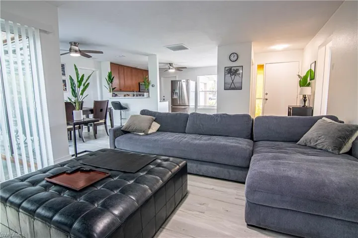 Living area with light wood-type flooring