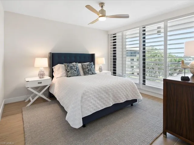 Bedroom featuring a ceiling fan and light wood-type flooring