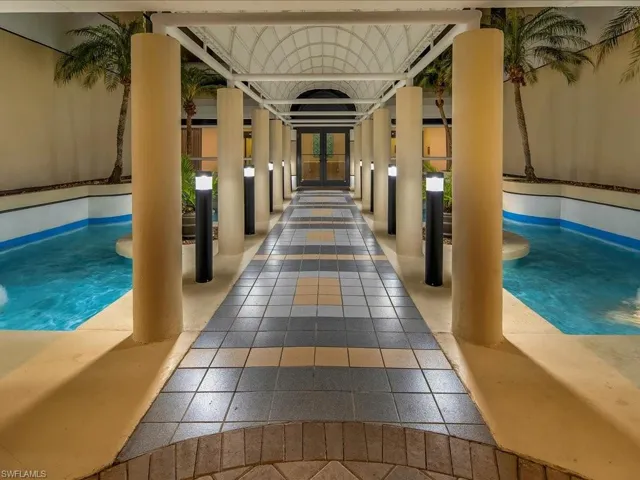 Indoor pool with french doors and a patio