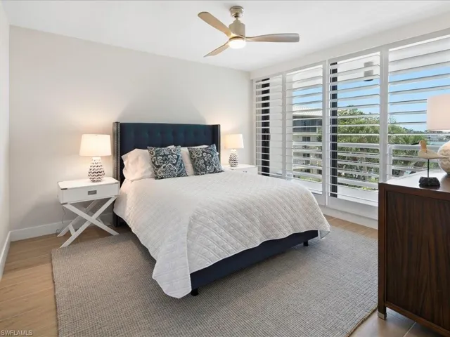 Bedroom with a ceiling fan and light wood finished floors