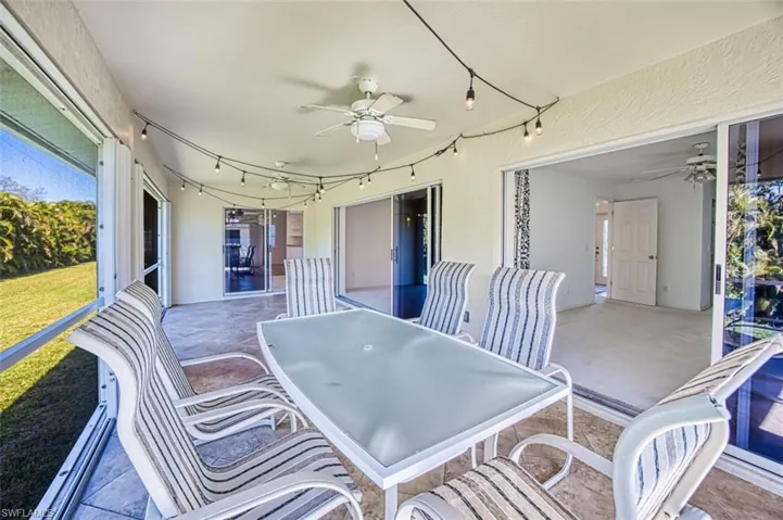 Sunroom / solarium featuring ceiling fan