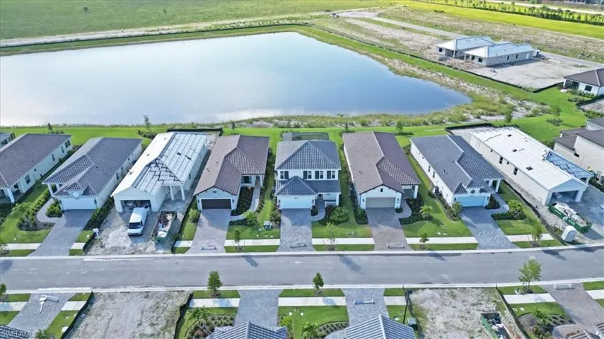 Aerial view of residential area with a nearby body of water