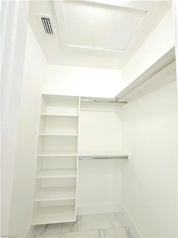 Spacious closet featuring light tile patterned floors