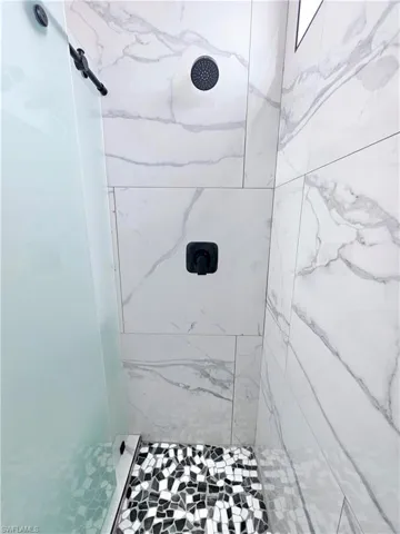 Bathroom with tiled shower