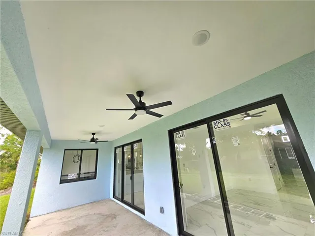 View of patio featuring ceiling fan