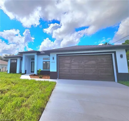 View of front of property with a garage