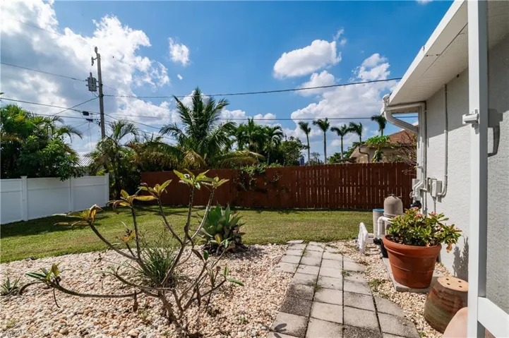 Fenced backyard featuring a patio