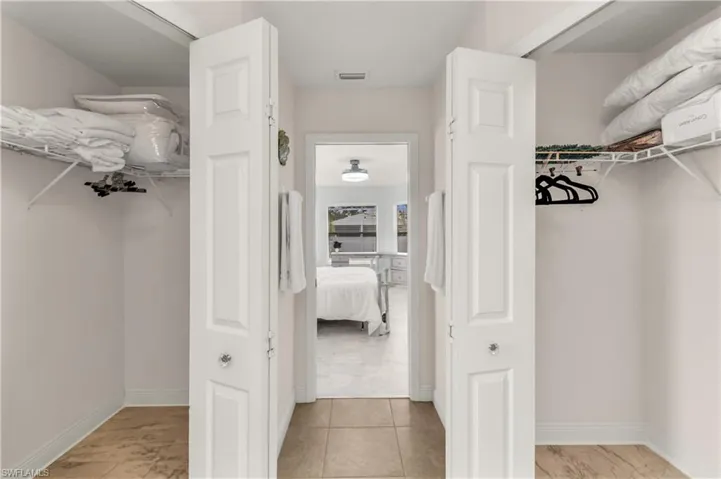 Walk in closet featuring light tile patterned floors