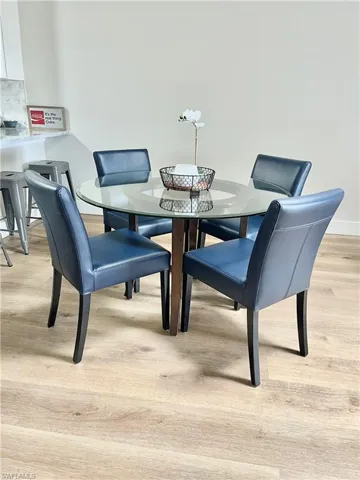 Dining space with light wood-type flooring