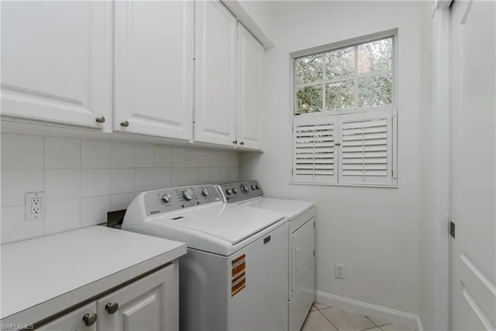 Laundry room with plenty of cabinets