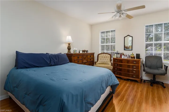 Main bedroom with 2 windows and ceiling fan