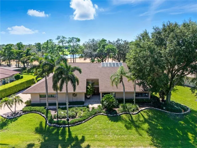 Lots of lush landscaping around this custom home.
