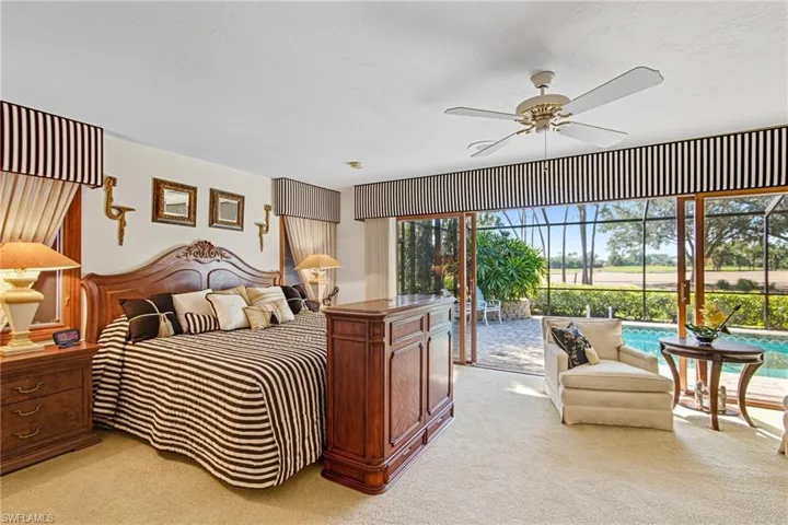 Spacious owner's suite with sliders to the lanai.