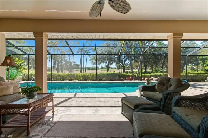 Outdoor pool featuring an outdoor hangout area, a sunroom, a patio, and ceiling fan