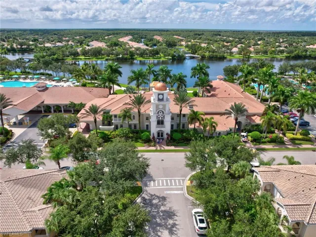 Birds eye view of property with a water view