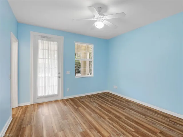 Unfurnished room featuring ceiling fan and hardwood / wood-style flooring