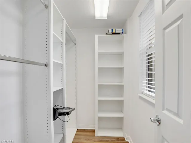 Walk in closet featuring light hardwood / wood-style floors
