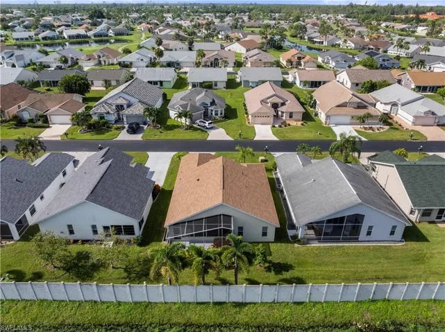 House is the first row in the middle with a brown roof.