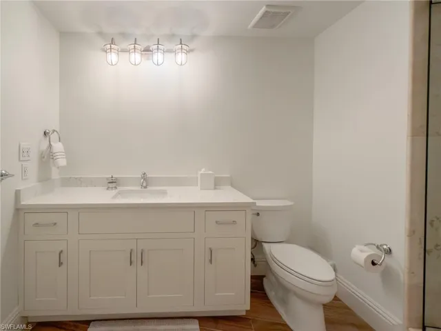 Bathroom featuring vanity and light wood-type flooring