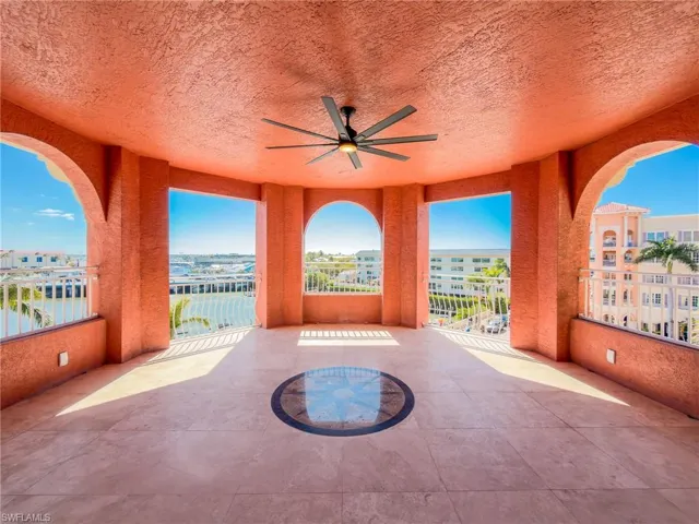 View of patio featuring a ceiling fan