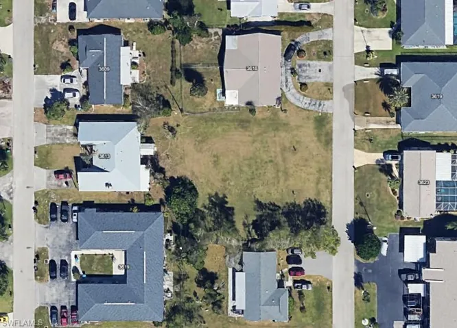 Aerial overview of property's location with nearby suburban area