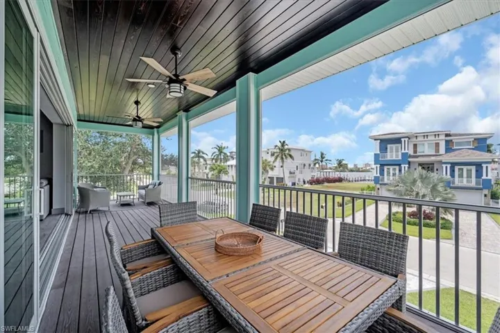 Wooden deck featuring ceiling fan